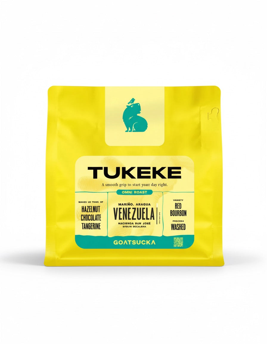 Paquete de café Venezuela Tukeke con notas de avellana, chocolate y mandarina, tostado por Goatsucka Coffee Co. en Lisboa.