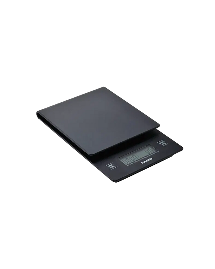 Báscula Hario negra con temporizador incorporado y pantalla digital para medir café y agua precisa hasta 2000 gramos.