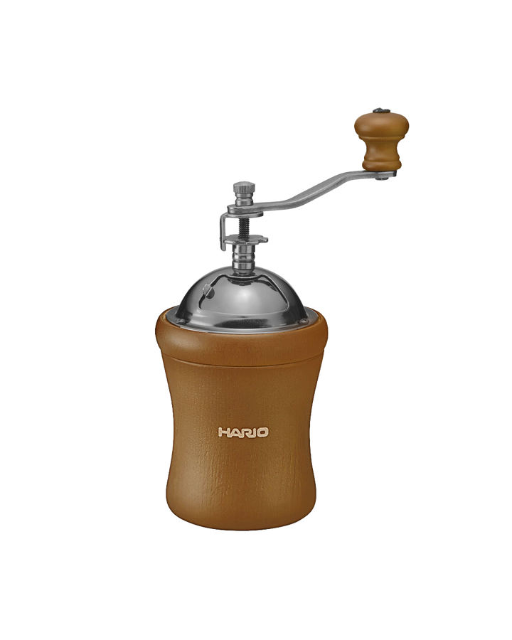 Molino de café manual Hario Mill Dome con muelas de cerámica y manivela de madera, diseño compacto y portátil para 1-3 tazas.